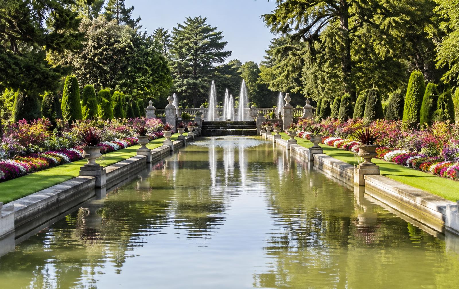 A long reflecting canal with fountains and flower borders at the Daniel Stowe Conservancy